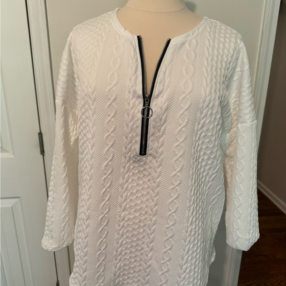 Brand unknown. Size 1X. White with zip front. Never worn, like new.